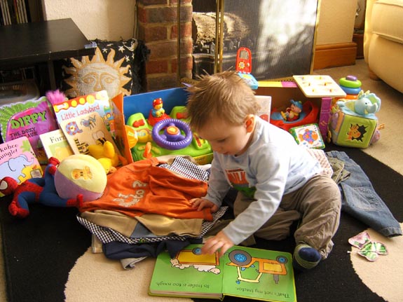 [Tom playing with his presents]