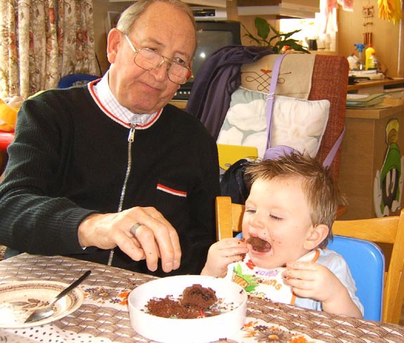 [Grandad's not sure about Tom's table manners...]