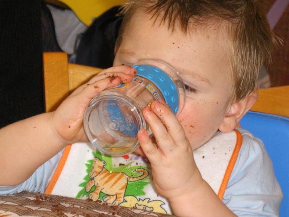 [Washing his cake down with a quick drink]