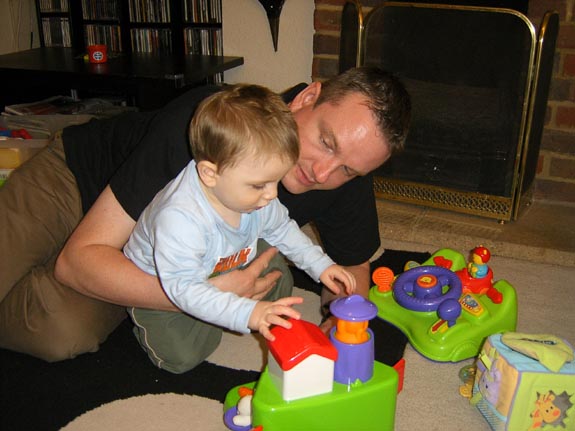 [Tom (and daddy) playing with his birthday toys]