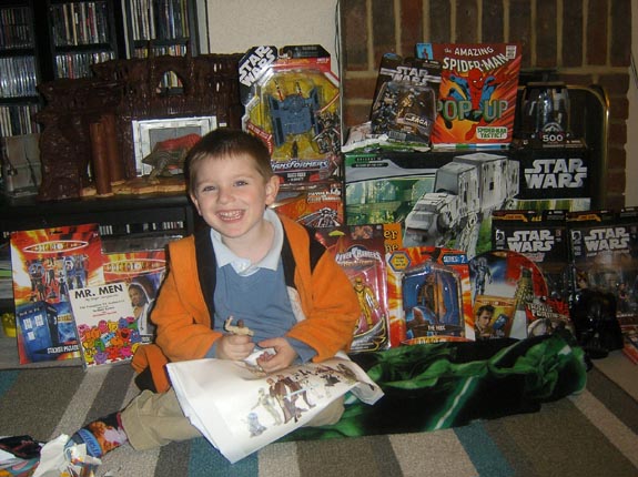 [Tom's got shedloads of presents for his Fourth Birthday!]