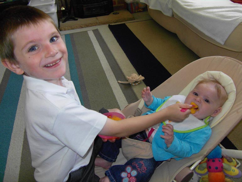 [Tom loves feeding Emma]